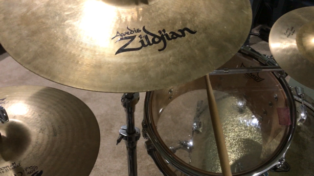 drums and cymbals set up too close to one another