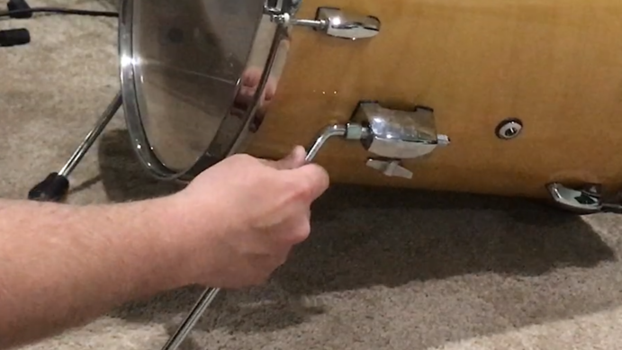 inserting the legs for a floor tom kick drum kit