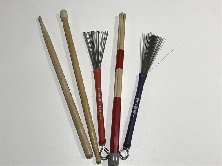 an assortment of drum sticks brushes soft mallets and rods each a making different snare drum sound