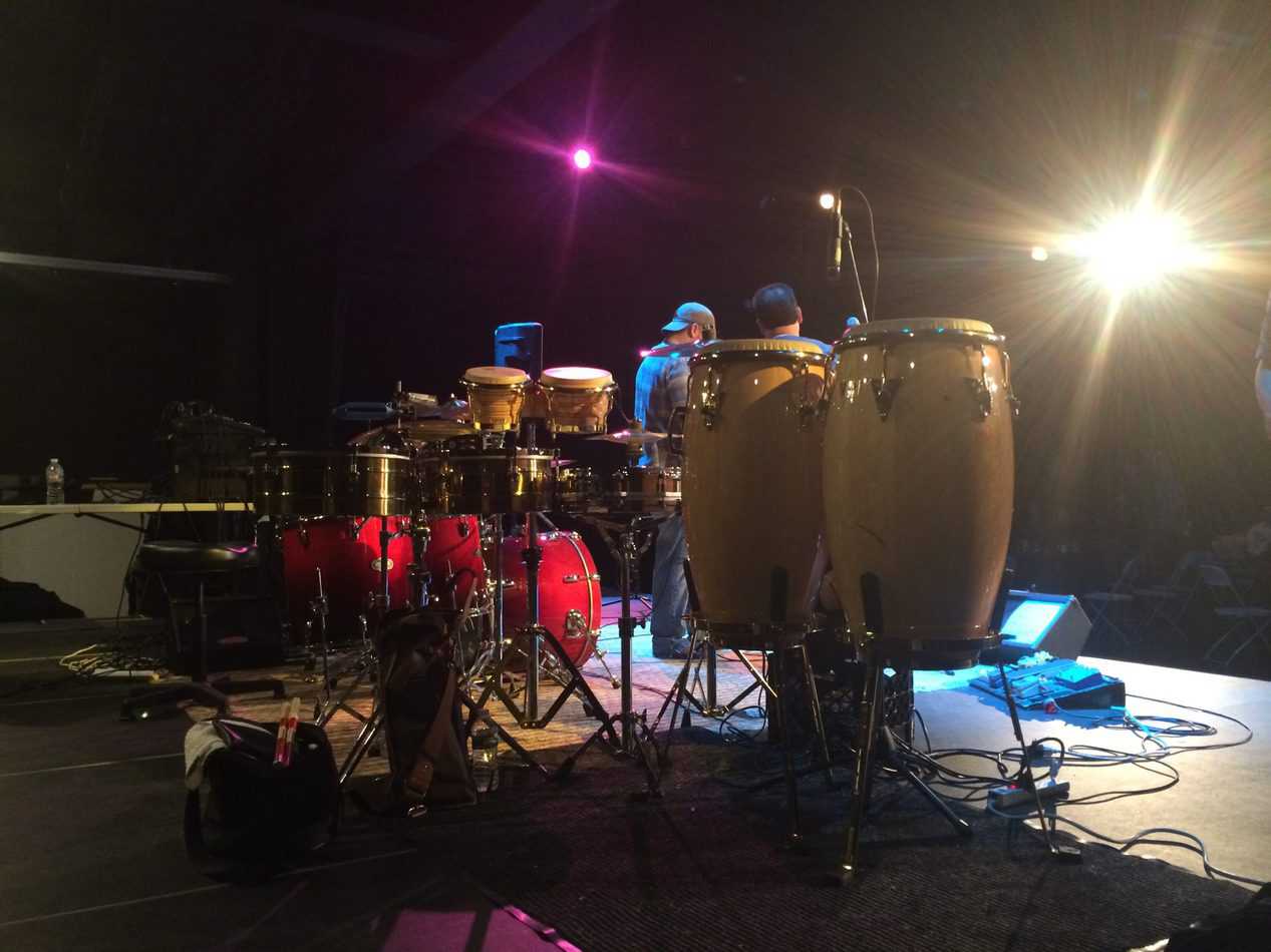 photo from the side back stage of congas timbale bongo setup on stage