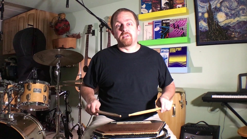 drummer demonstrating ready position with arms, hands, and sticks ready to practice drums