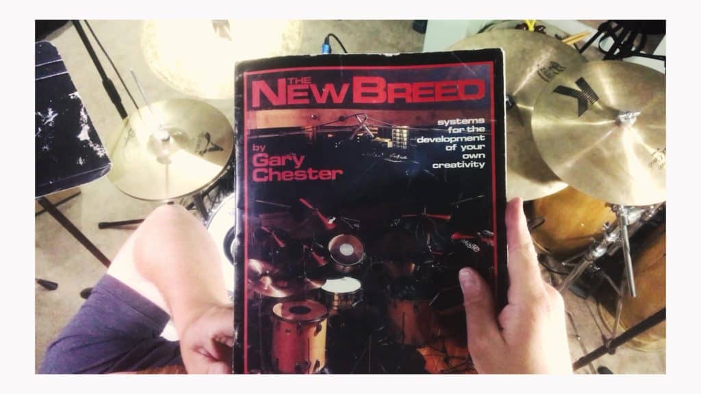 new breed drum method book held up for the overhead camera