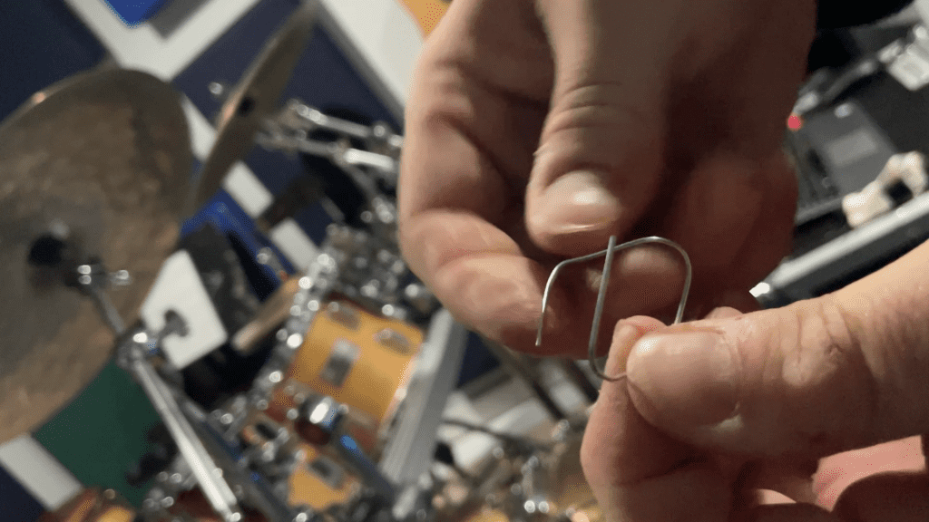 reshaping paperclip to make a sizzle sound in the cymbal